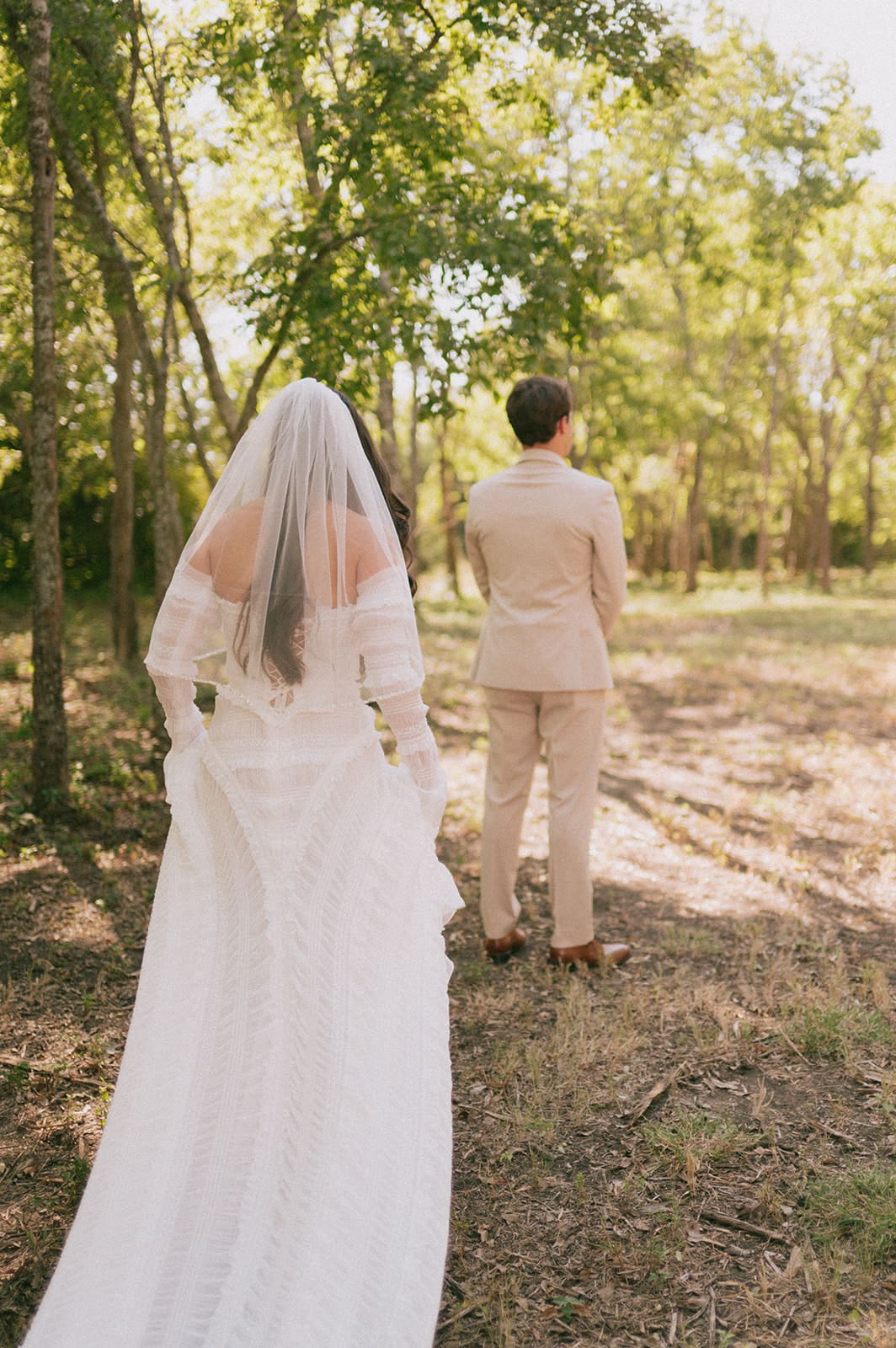 bride and groom share a first look outdoors for their backyard wedding 