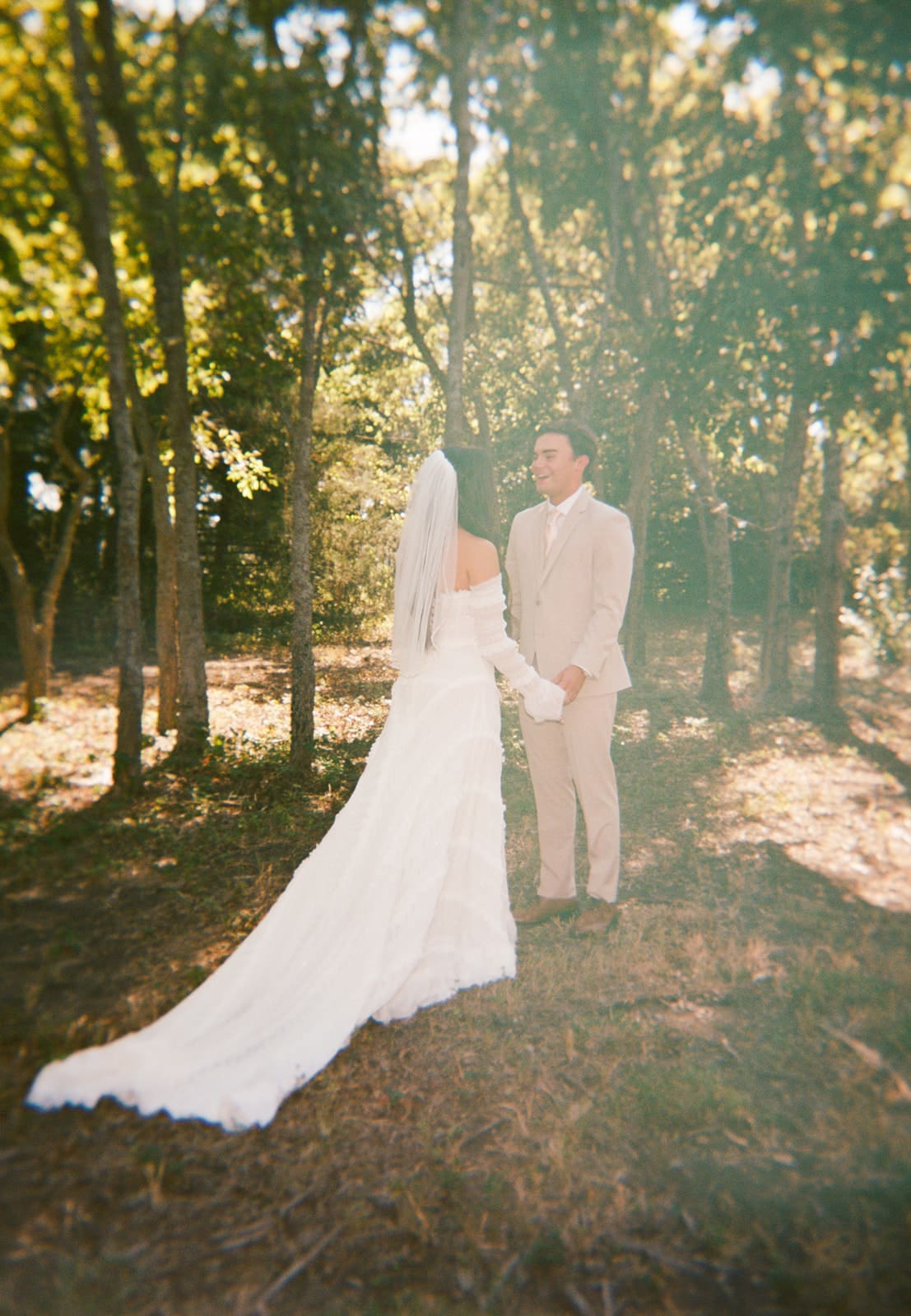 bride and groom share a first look outdoors for their backyard wedding 