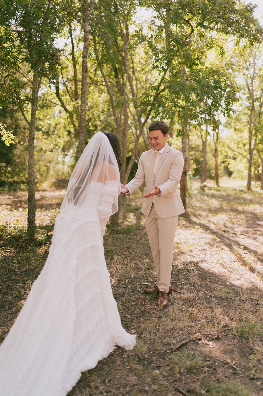 bride and groom share a first look outdoors for their backyard wedding 