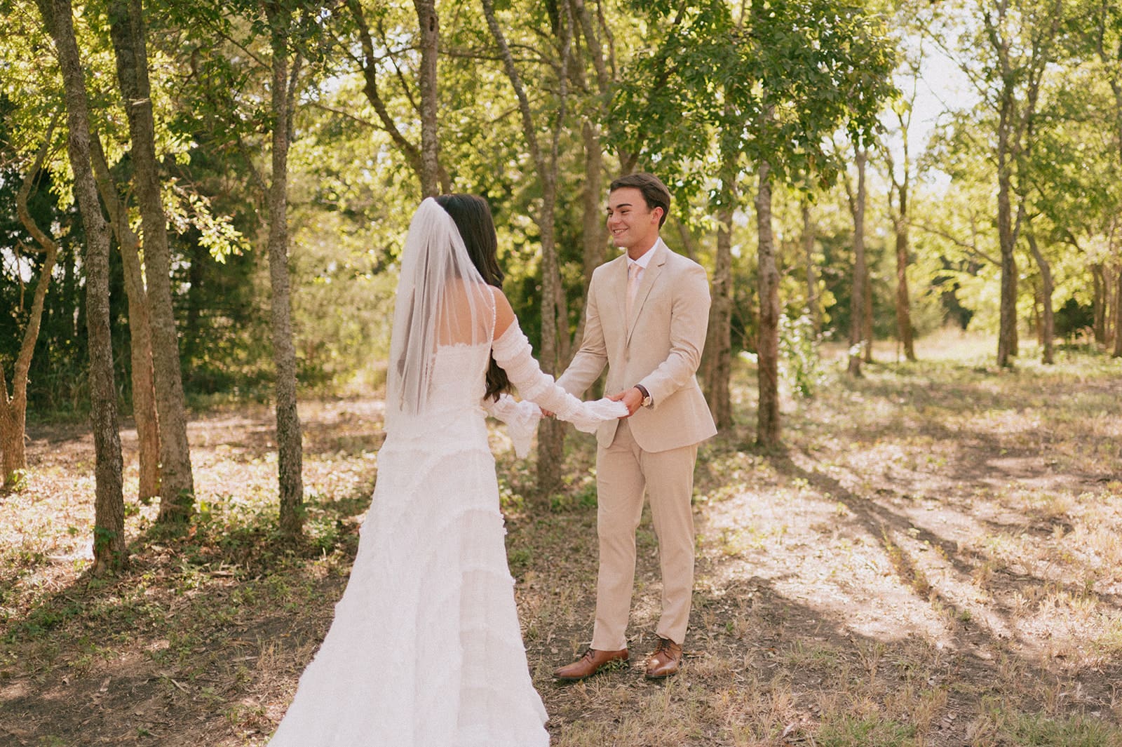 bride and groom share a first look outdoors for their backyard wedding 
