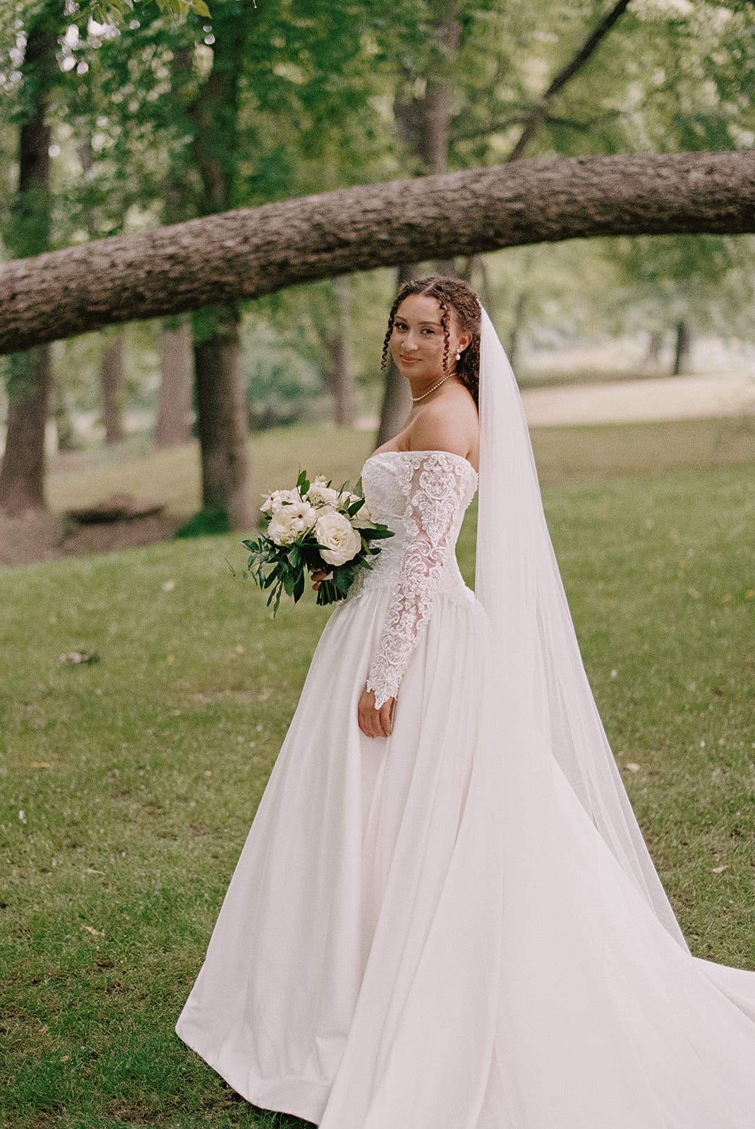 a bride outdoors taking bridal portraits 