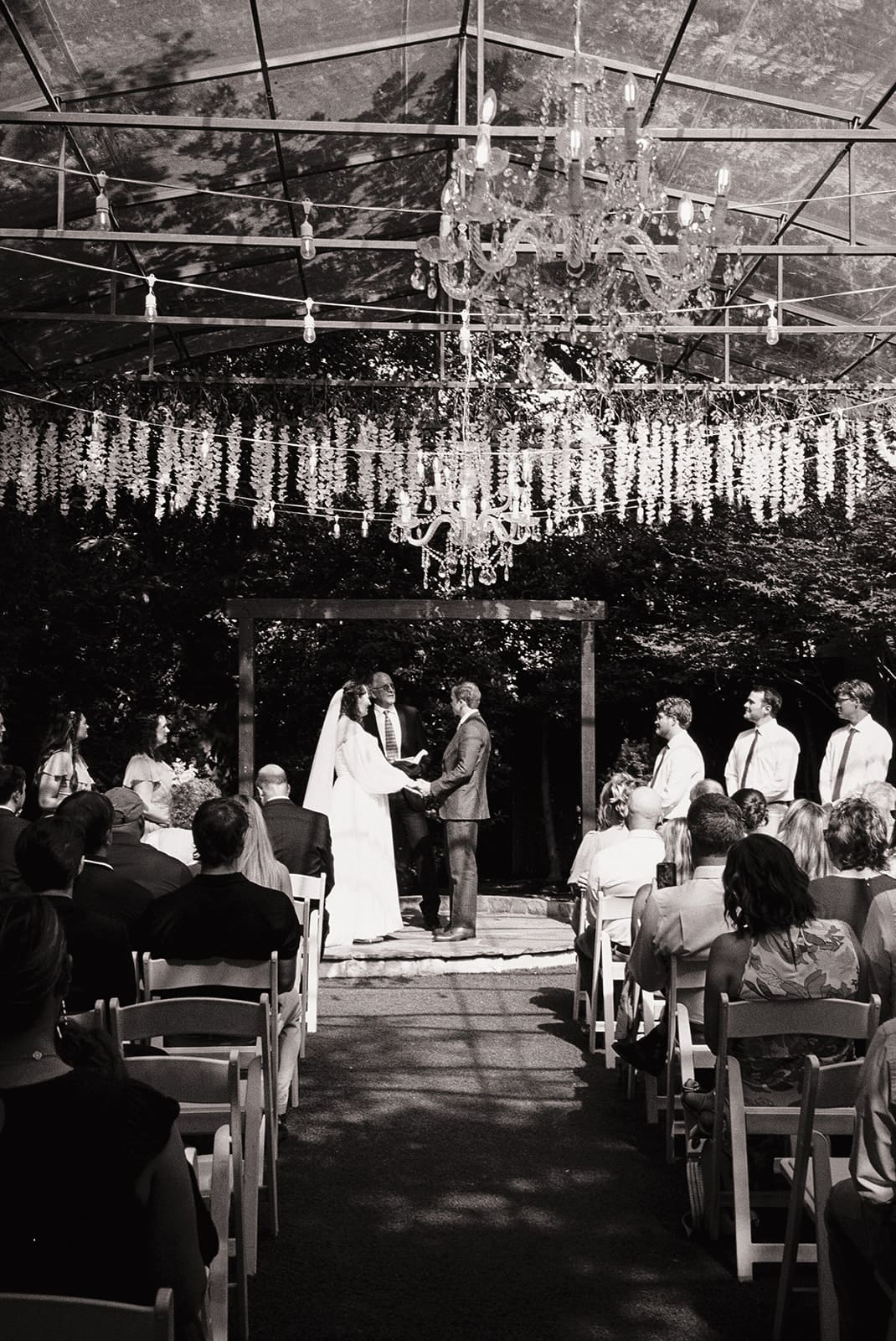 an outdoor wedding ceremony at Magnolia Terrace in Frisco, Tx
