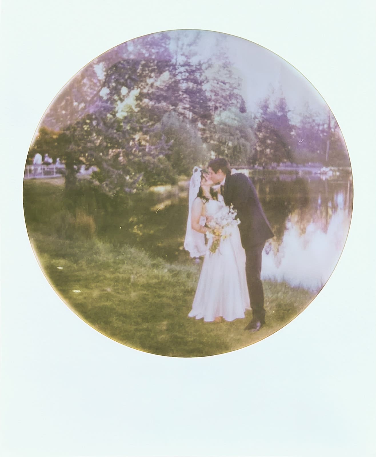 Two people stand facing each other on a wooden bridge surrounded by trees, with sunlight casting shadows across the scene. | 9 Wedding Venues in Oregon for an Intimate Celebration: Rowen and Brandon’s Bend Wedding