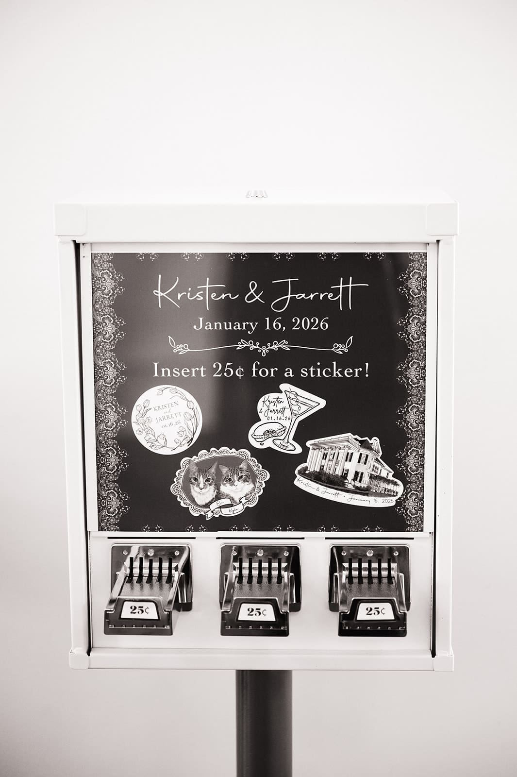 Black and white photo of a sticker vending machine labeled for Kristin & Jarrett’s event, offering stickers for 25 cents each with three selection slots visible.