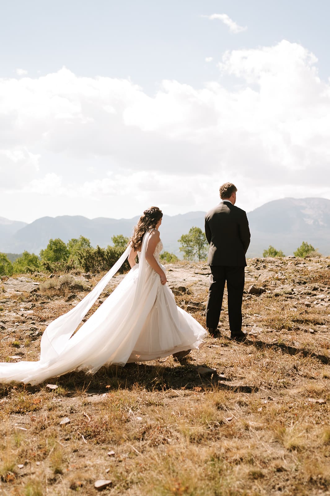 Bride and groom during their mountain first look before an intimate Colorado wedding