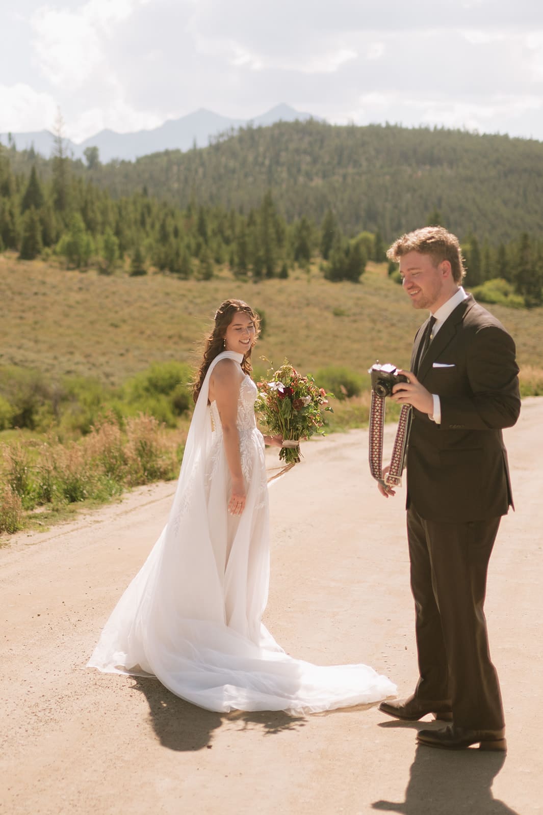 Bride and groom exchanging letters during their intimate mountain wedding in Colorado